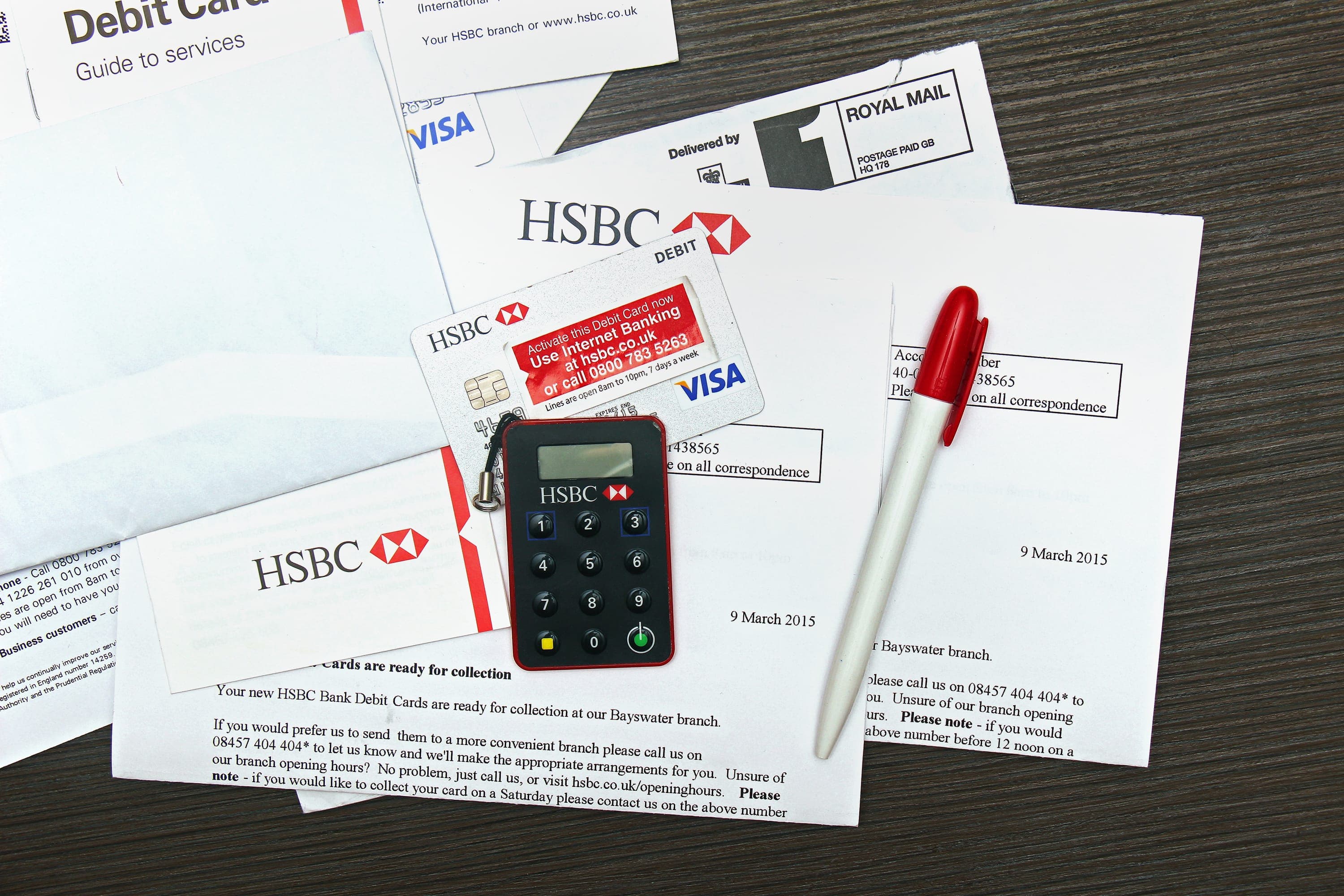Bank documents, debit card and financial paperwork representing funding support