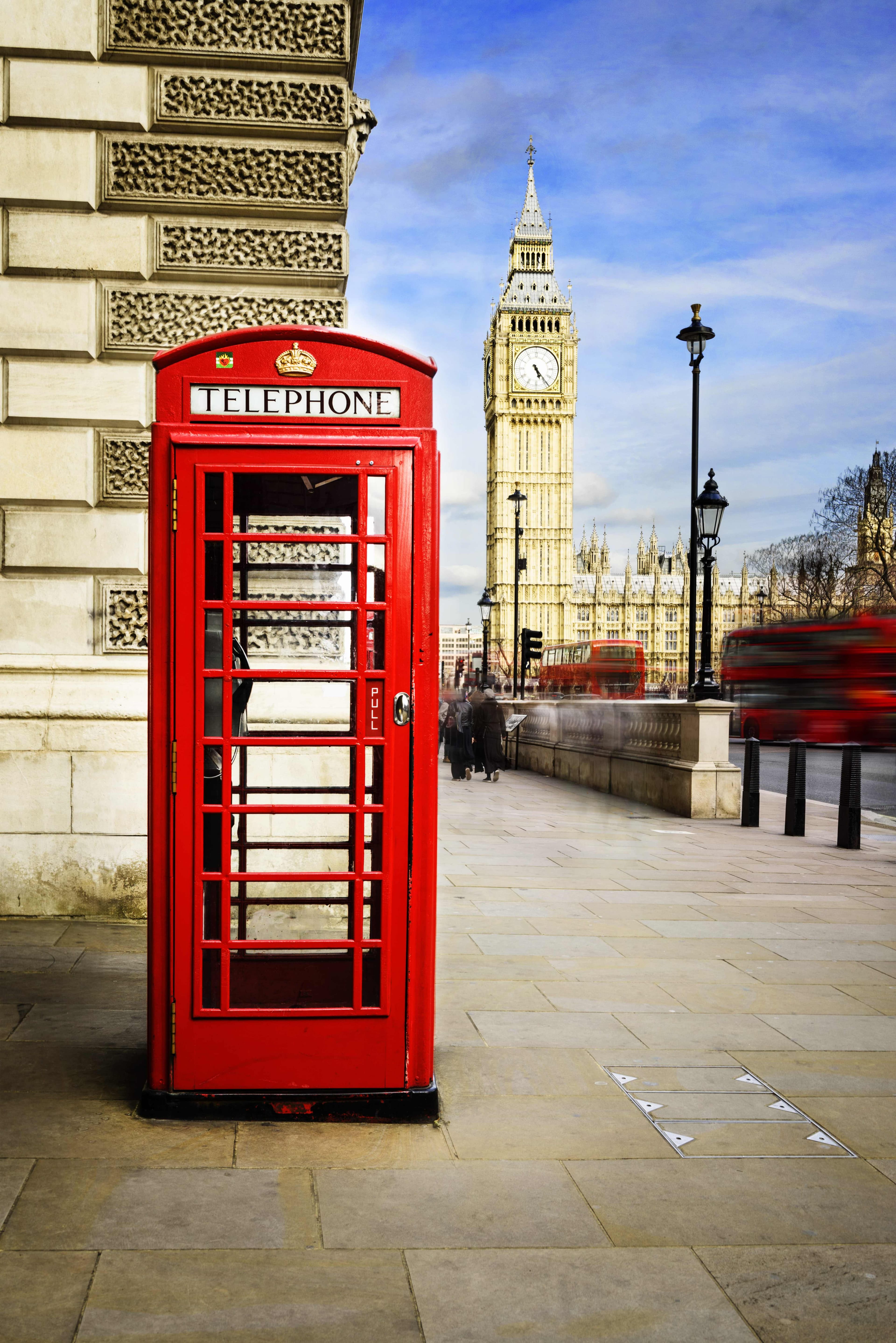 Iconic red telephone box with Big Ben and the Houses of Parliament in London
